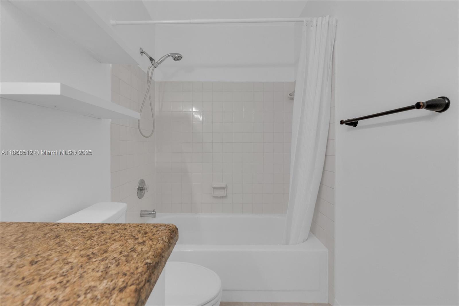 13440 Southwest 81st Street Miami, FL 33183 - Photo 17 of 23 a bathroom with a granite countertop bathtub shower and toilet