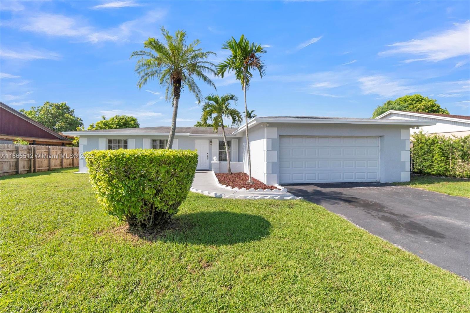 13440 Southwest 81st Street Miami, FL 33183 - Photo 23 of 23 a view of a house with backyard and a garden