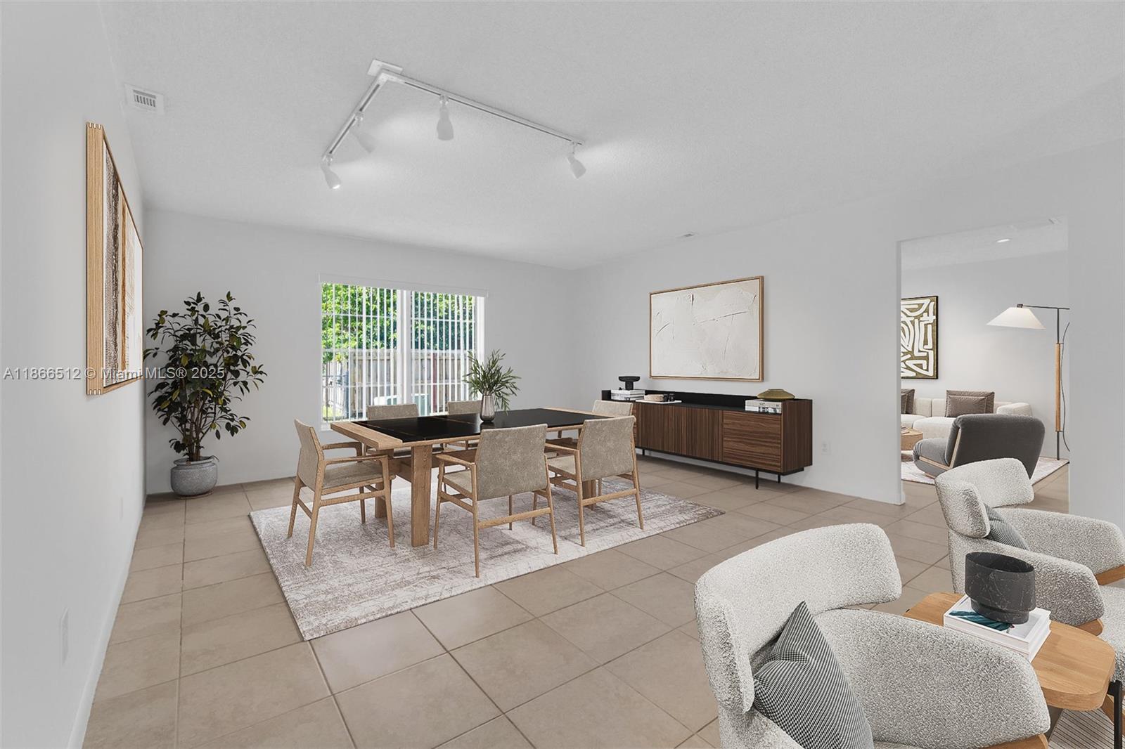 13440 Southwest 81st Street Miami, FL 33183 - Photo 7 of 23 a living room with furniture and a large window