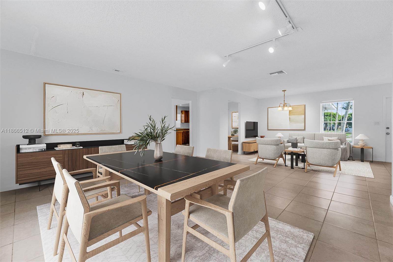 13440 Southwest 81st Street Miami, FL 33183 - Photo 8 of 23 a kitchen with a dining table and chairs