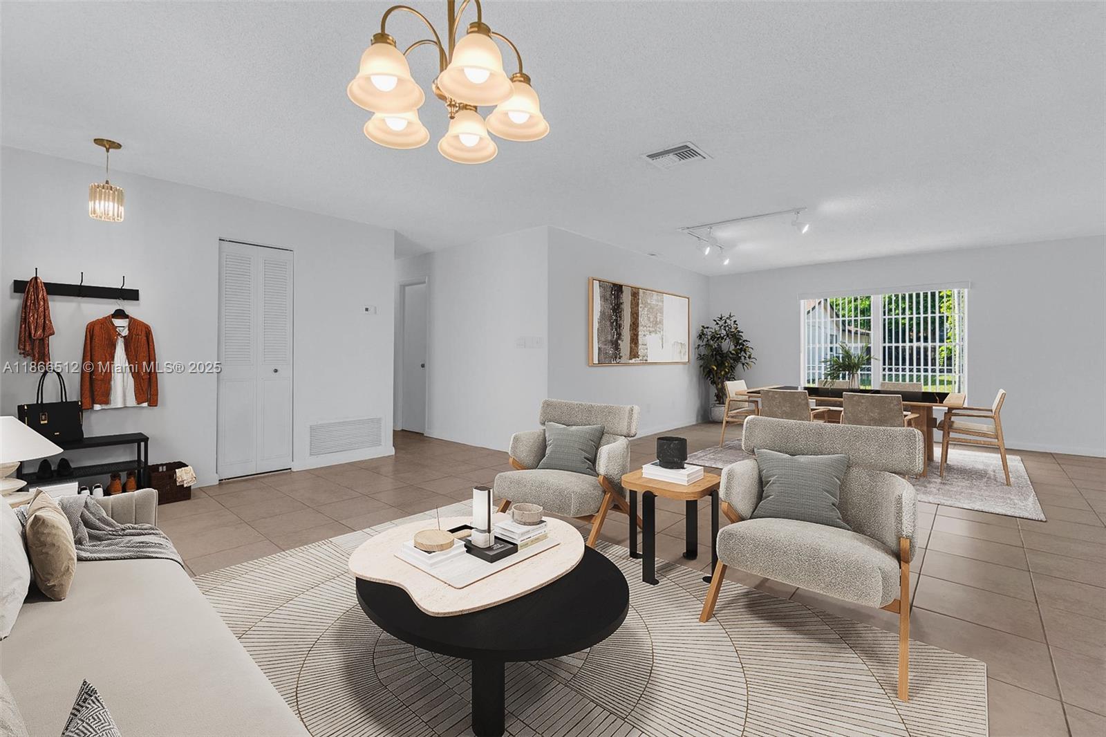 13440 Southwest 81st Street Miami, FL 33183 - Photo 9 of 23 a living room with furniture a rug and a window