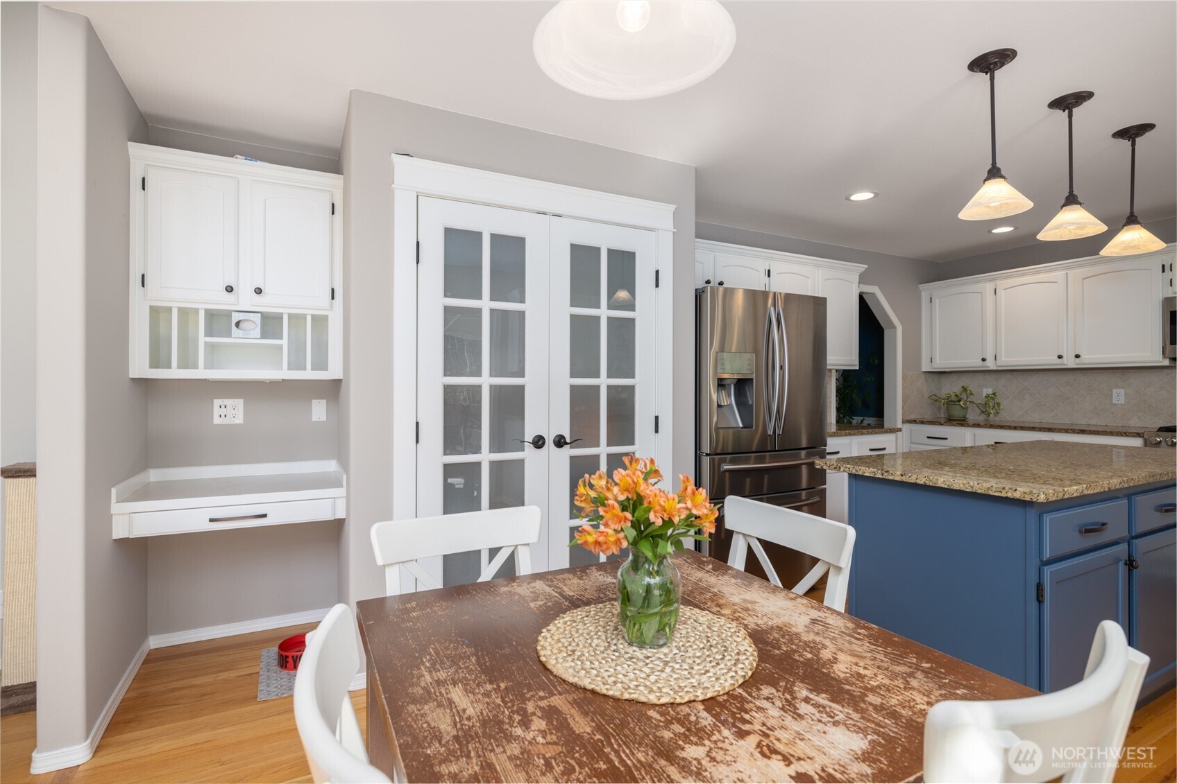 1014 South 38th Place Mount Vernon, WA 98274 - Photo 11 of 39 a kitchen with a dining table cabinets and stainless steel appliances