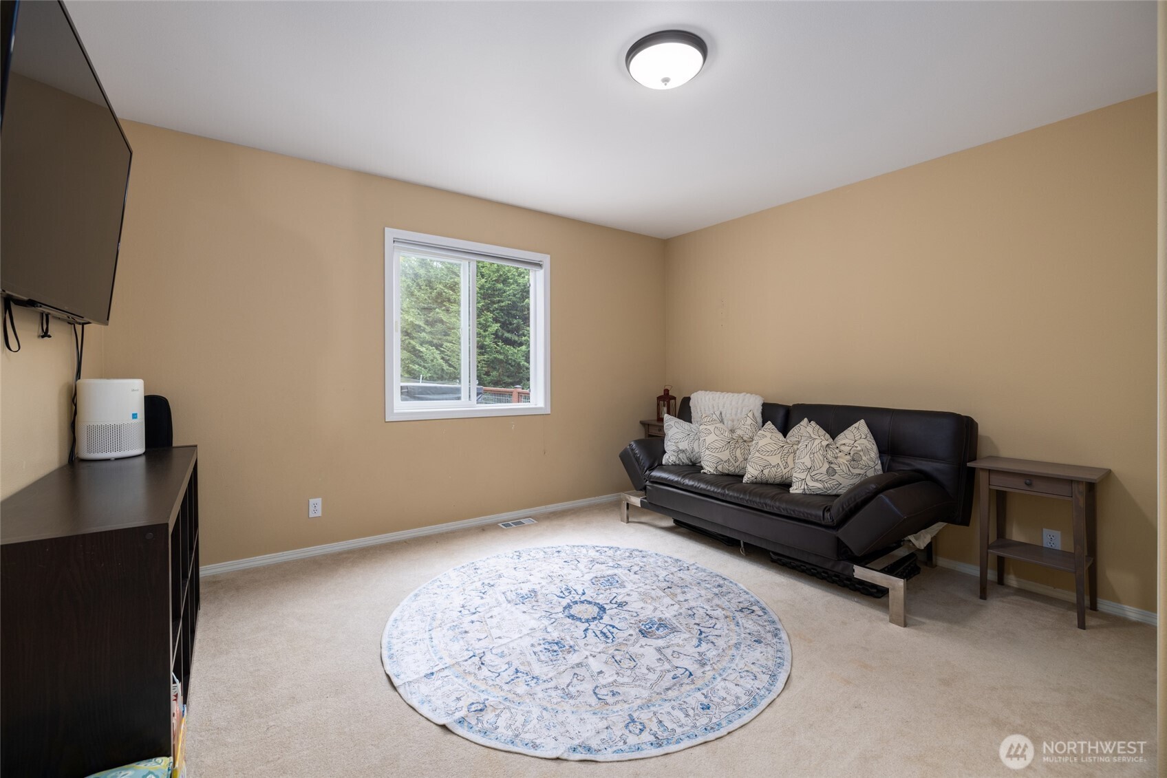 1014 South 38th Place Mount Vernon, WA 98274 - Photo 15 of 39 a living room with furniture and a flat screen tv