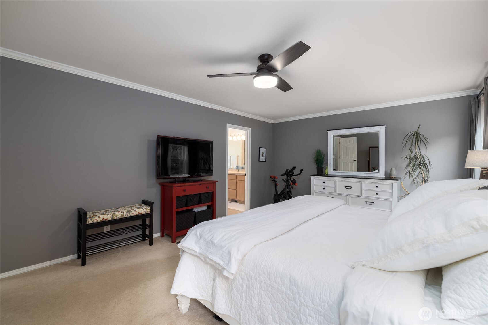 1014 South 38th Place Mount Vernon, WA 98274 - Photo 19 of 39 a bedroom with a bed and a flat screen tv