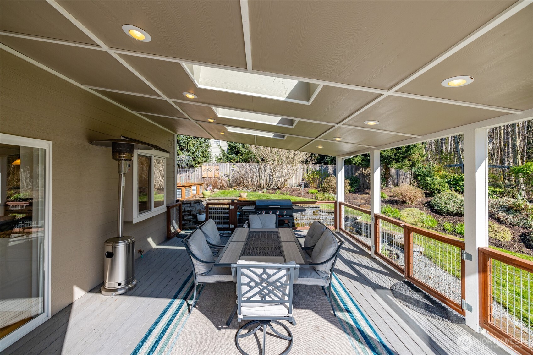 1014 South 38th Place Mount Vernon, WA 98274 - Photo 27 of 39 a view of a chairs and table in a patio