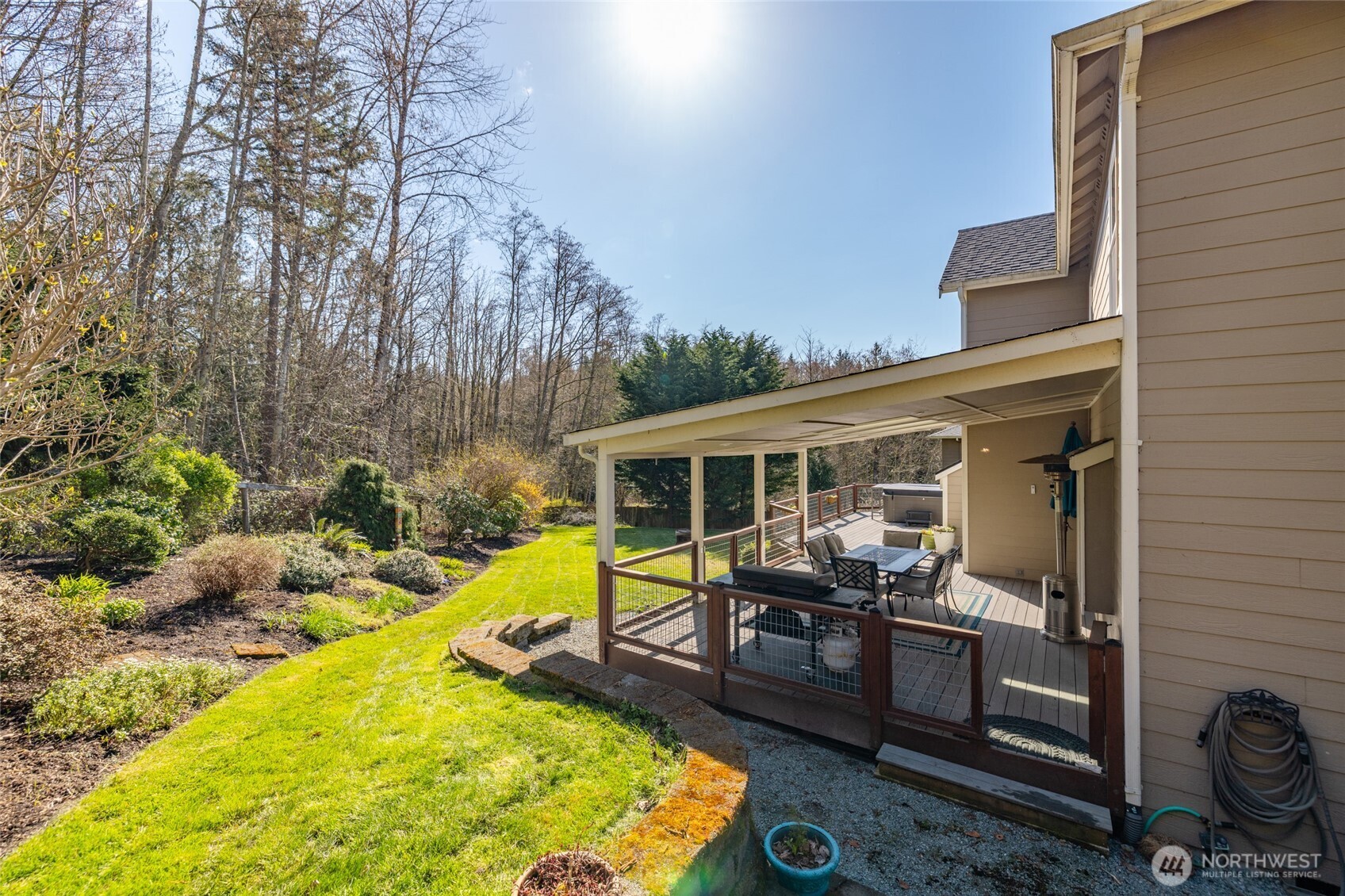 1014 South 38th Place Mount Vernon, WA 98274 - Photo 31 of 39 a view of a swimming pool with chairs in front of house