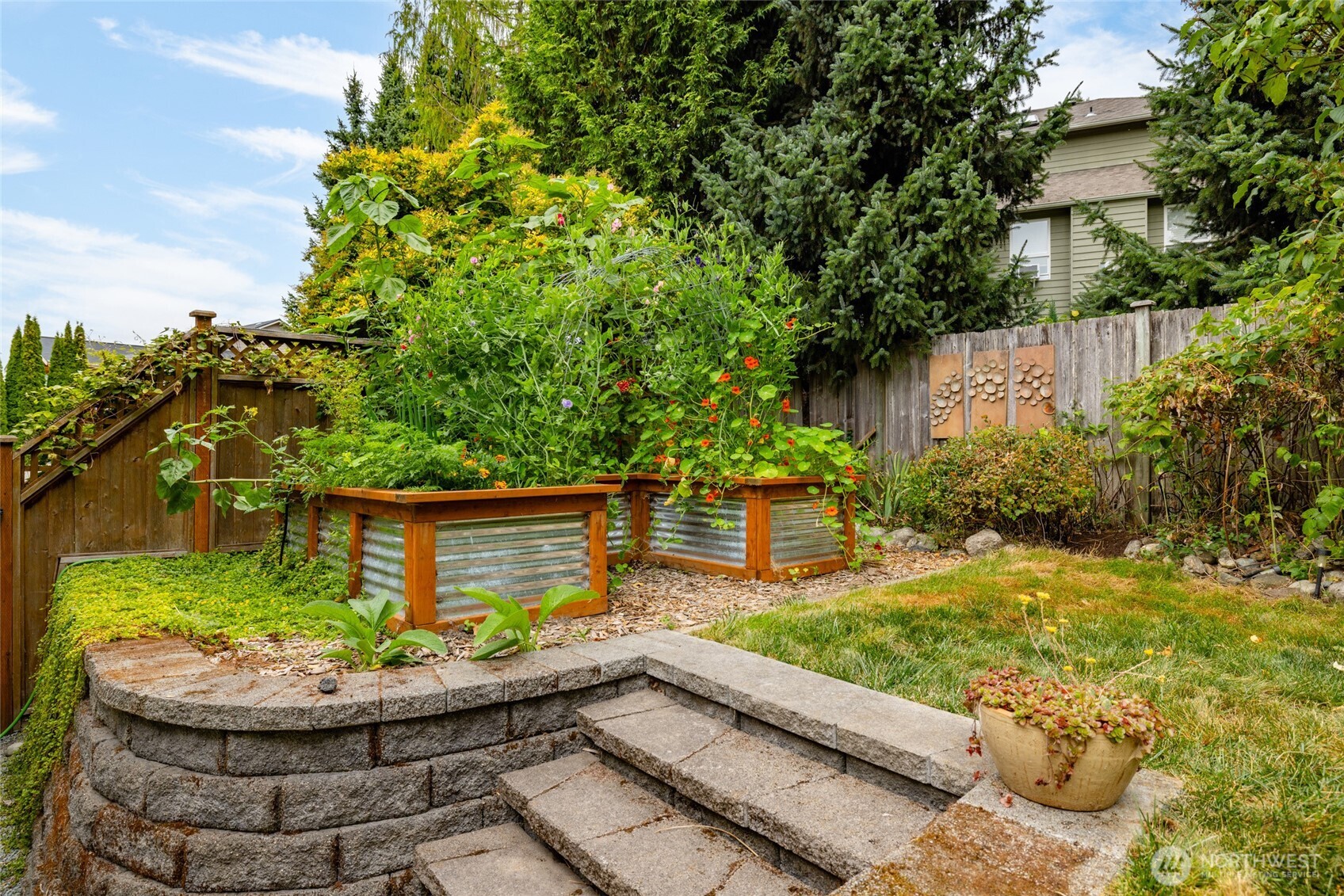 1014 South 38th Place Mount Vernon, WA 98274 - Photo 34 of 39 a view of a backyard with plants and a patio