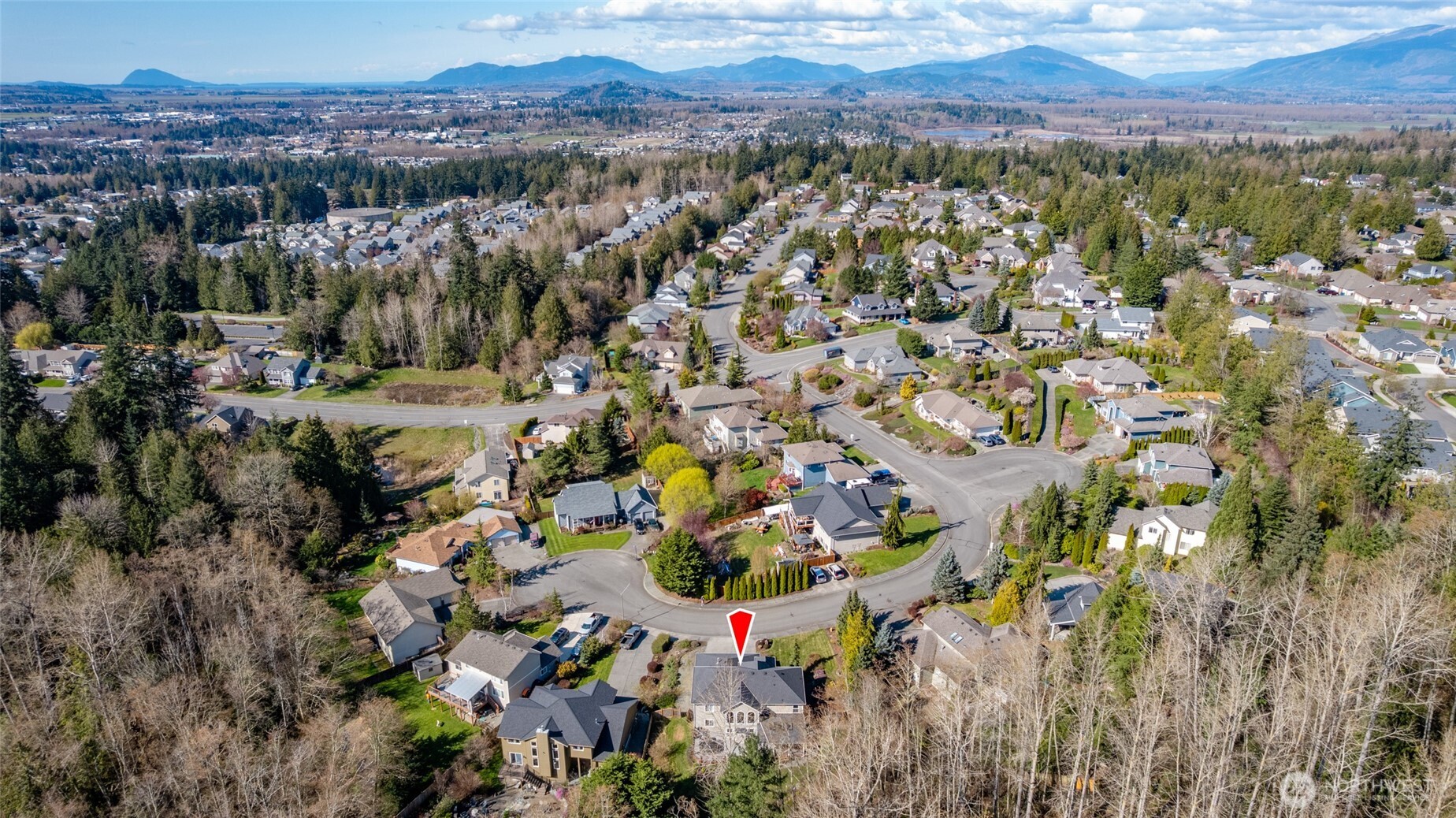 1014 South 38th Place Mount Vernon, WA 98274 - Photo 39 of 39 a view of a city with mountains in the background