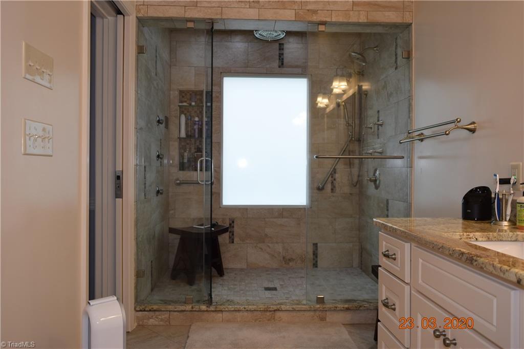 3003 Sides Road Rockwell, NC 28138 - Photo 13 of 30 Fantastic tile steam shower with multiple jets and rain shower head.