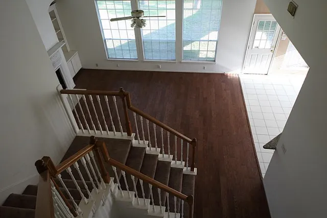 a view of entryway with wooden floor and stairs