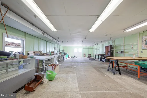 a view of a livingroom with furniture and a garage