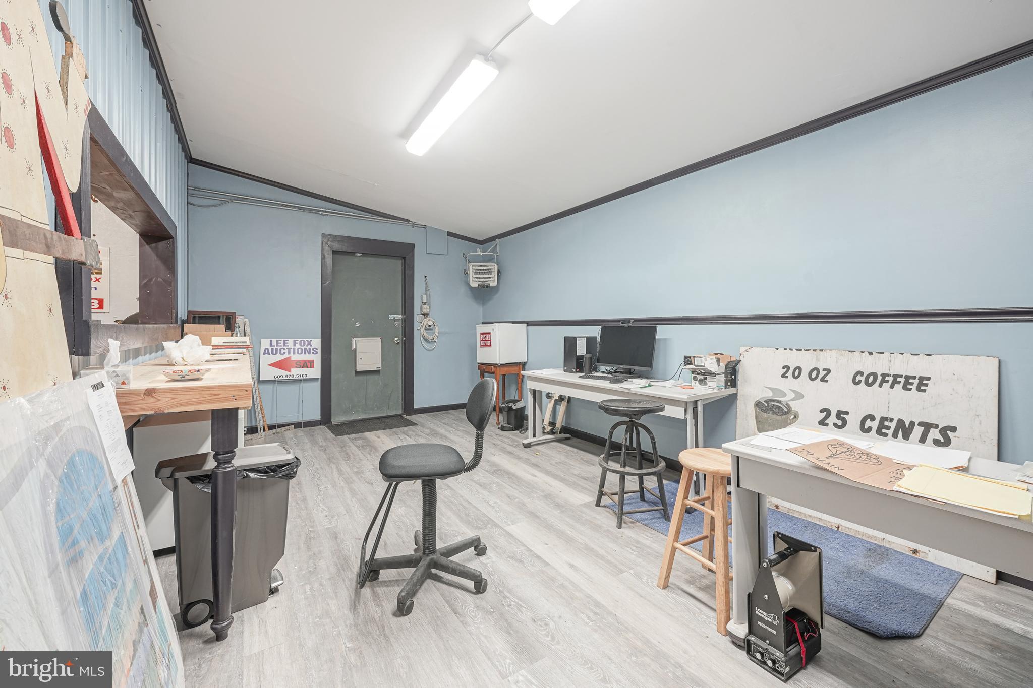 461 Three Bridge Road Newfield, NJ 08344 - Photo 25 of 30 a view of a workspace with furniture and a kitchen