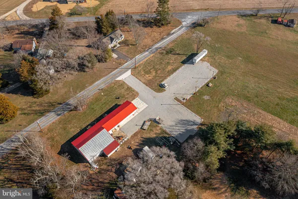 an aerial view of a house with outdoor space and street view