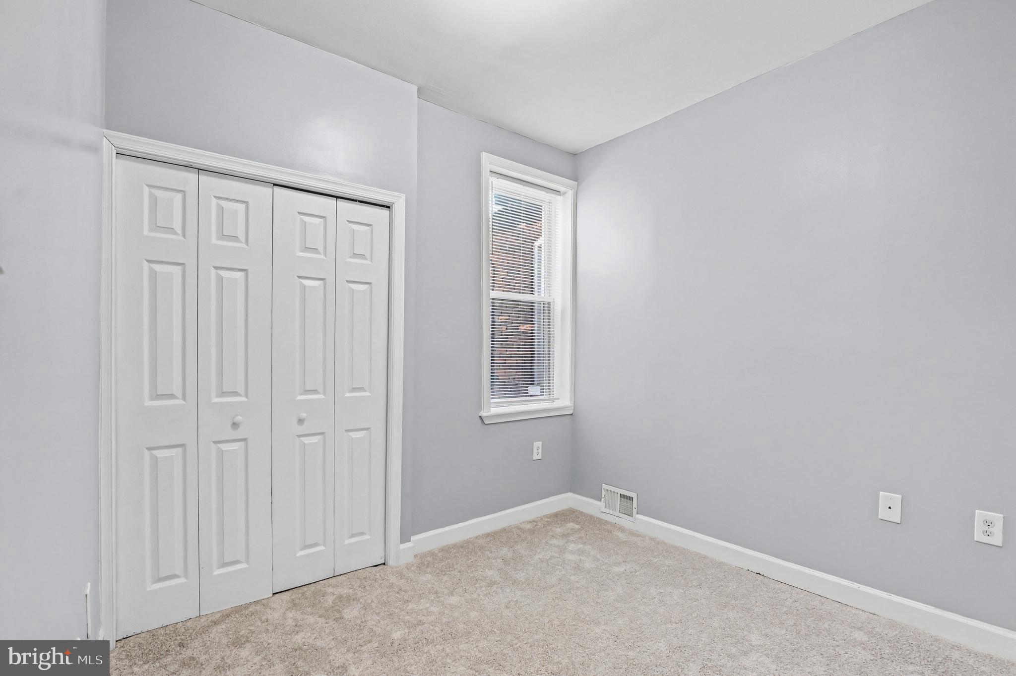 407 West 28th Street Baltimore, MD 21211 - Photo 11 of 30 an empty room with windows