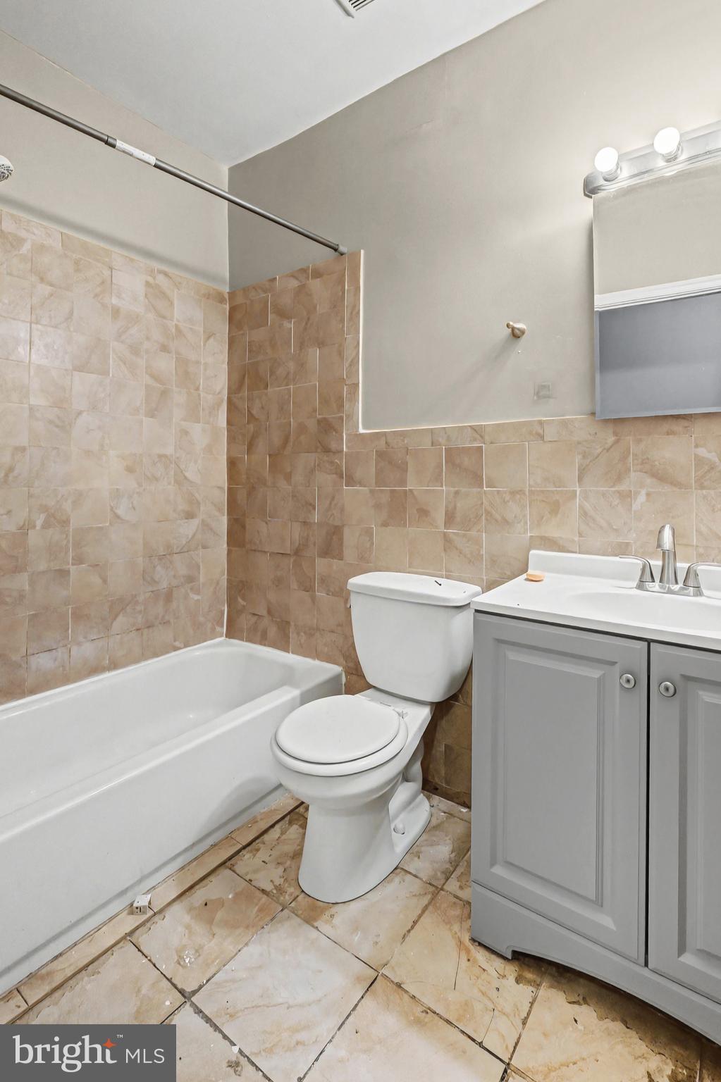 407 West 28th Street Baltimore, MD 21211 - Photo 14 of 30 a bathroom with a sink toilet and shower