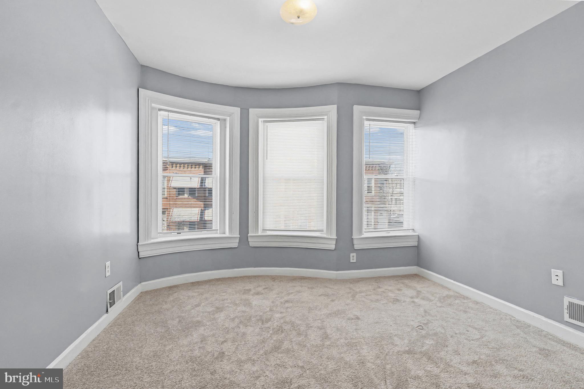 407 West 28th Street Baltimore, MD 21211 - Photo 17 of 30 an empty room with windows