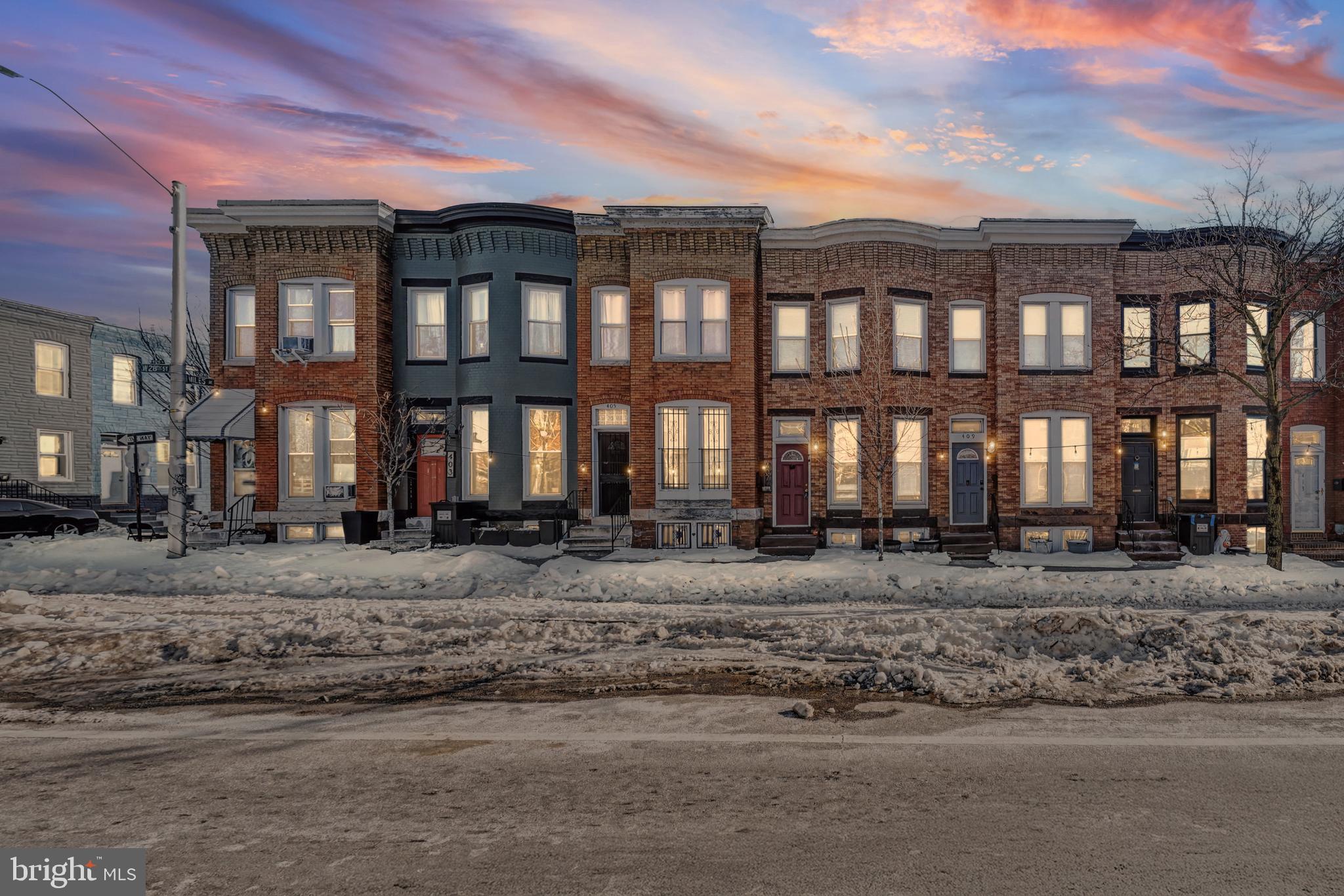 407 West 28th Street Baltimore, MD 21211 - Photo 26 of 30 a view of a large building next to a yard