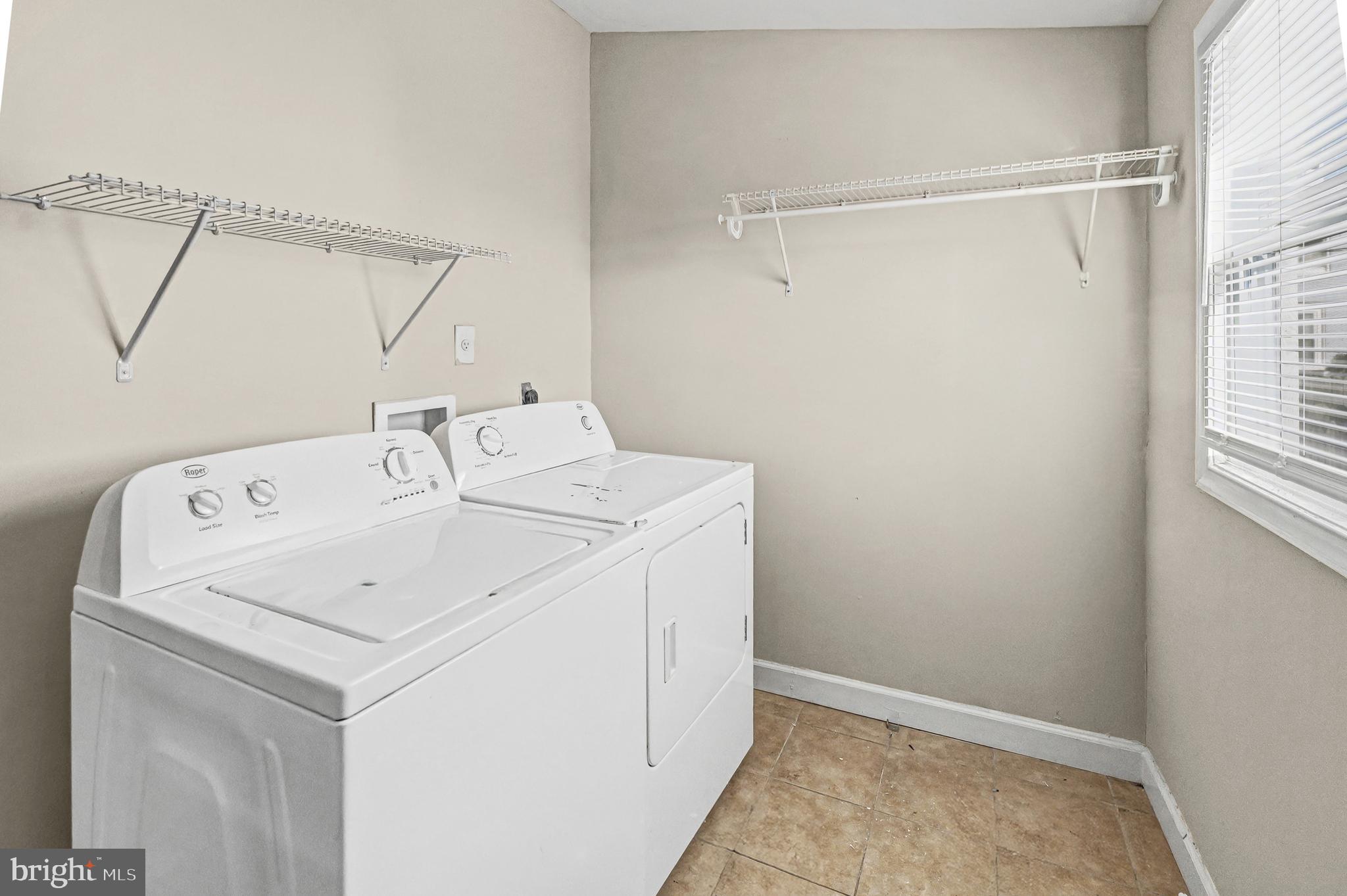 407 West 28th Street Baltimore, MD 21211 - Photo 5 of 30 a utility room with dryer and washer