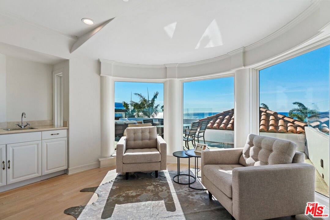 7112 Rindge Avenue Playa del Rey, CA 90293 - Photo 20 of 39 a living room with furniture and a large window