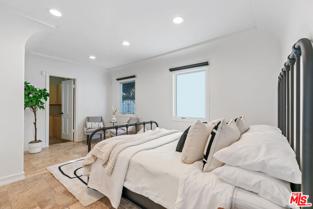7112 Rindge Avenue Playa del Rey, CA 90293 - Photo 28 of 39 a bedroom with furniture and a large window