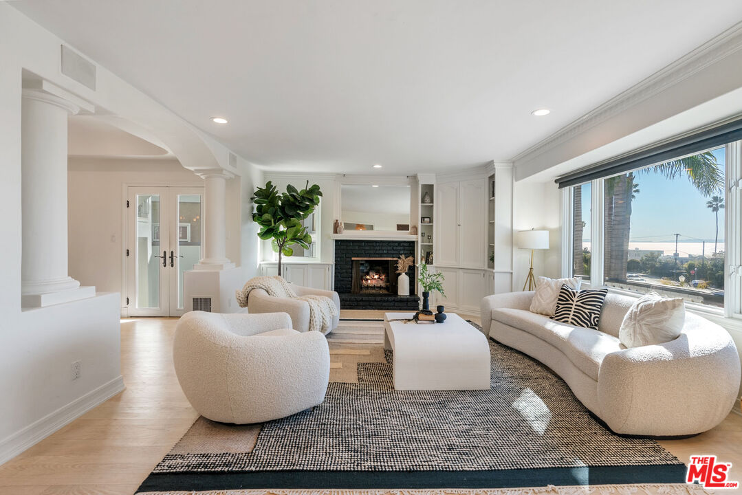 7112 Rindge Avenue Playa del Rey, CA 90293 - Photo 4 of 39 a living room with furniture and a fireplace