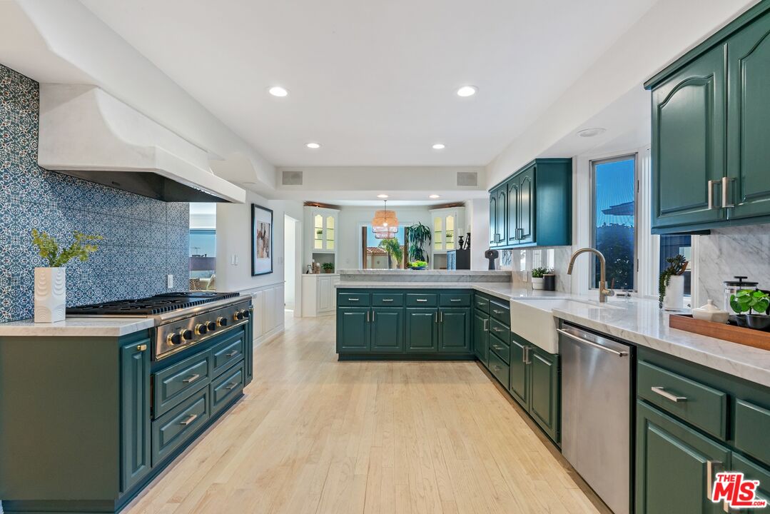 7112 Rindge Avenue Playa del Rey, CA 90293 - Photo 8 of 39 a kitchen with stainless steel appliances granite countertop a stove a sink and a refrigerator