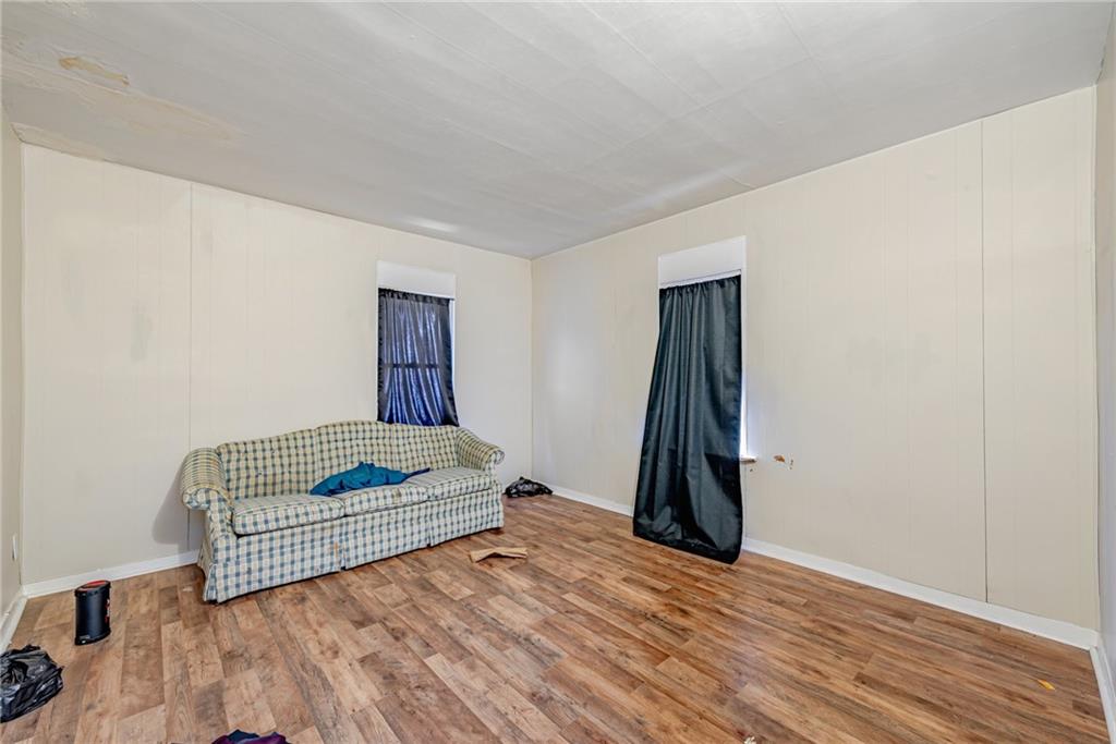 247 Marion Street McKees Rocks, PA 15136 - Photo 11 of 19 an empty room with wooden floor and gym equipment