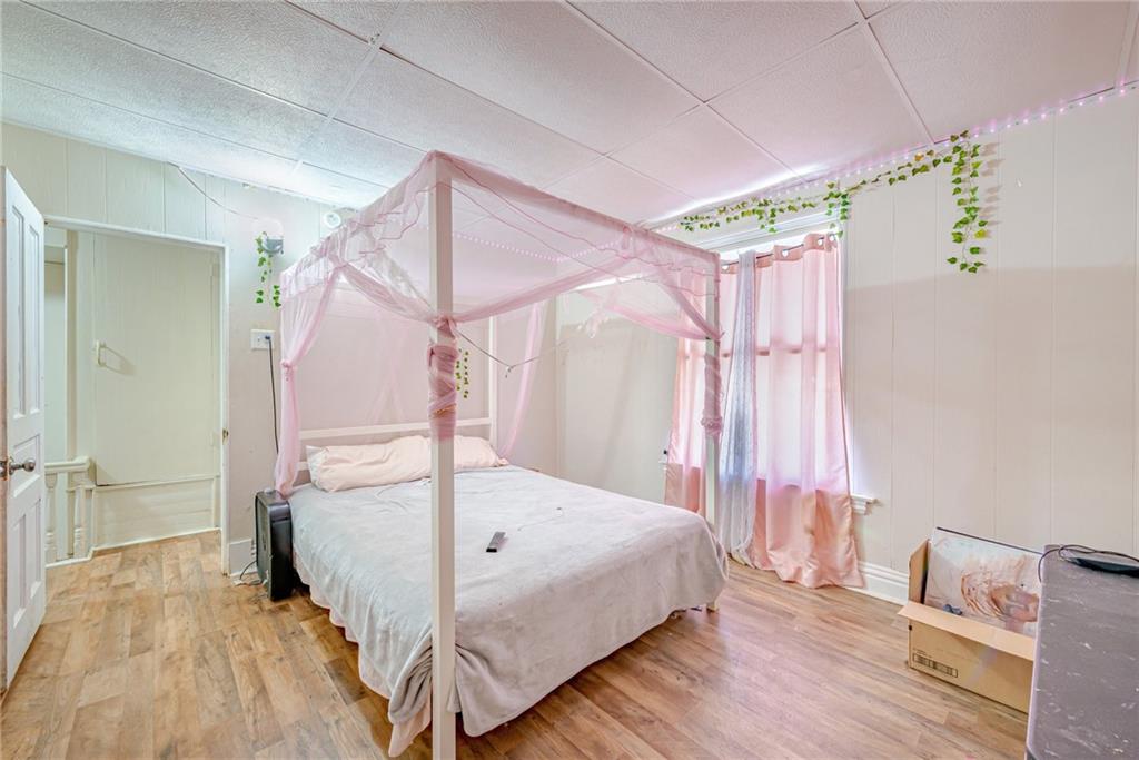 247 Marion Street McKees Rocks, PA 15136 - Photo 15 of 19 a bedroom with a bed and a mirror
