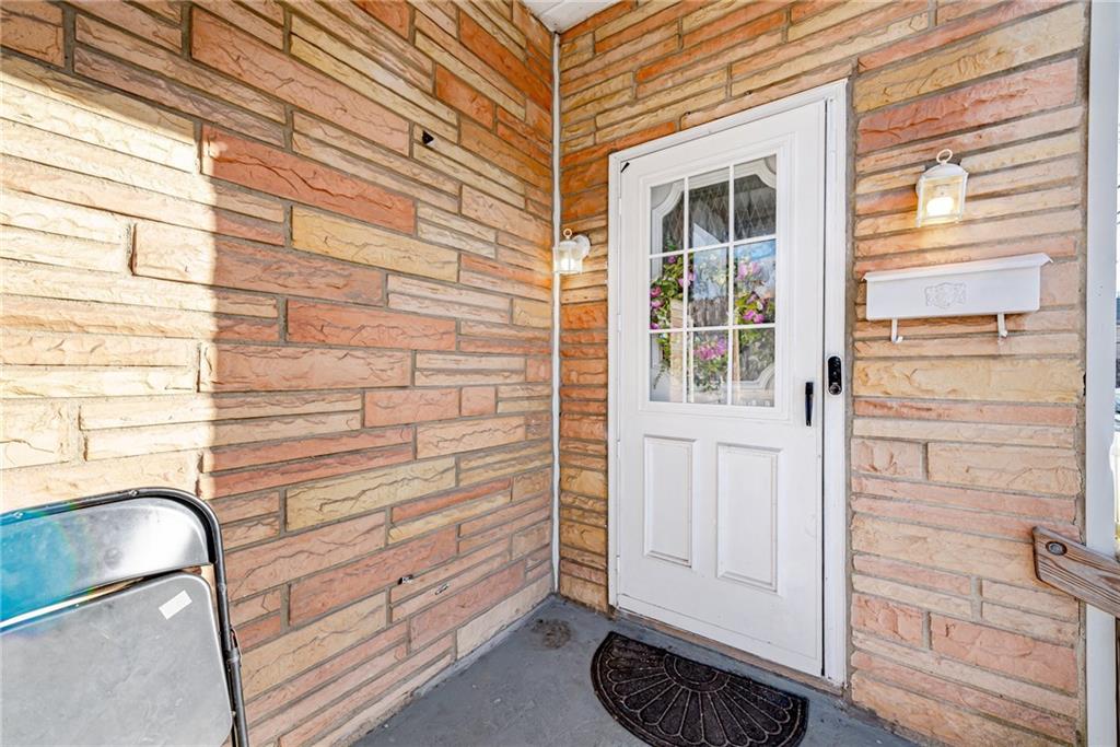 247 Marion Street McKees Rocks, PA 15136 - Photo 4 of 19 a view of a door and a window