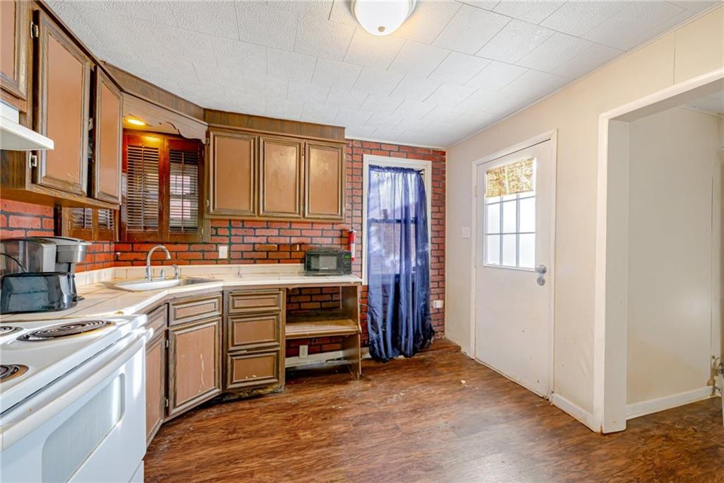 247 Marion Street McKees Rocks, PA 15136 - Photo 6 of 19 a view of kitchen with stainless steel appliances granite countertop a stove and a refrigerator