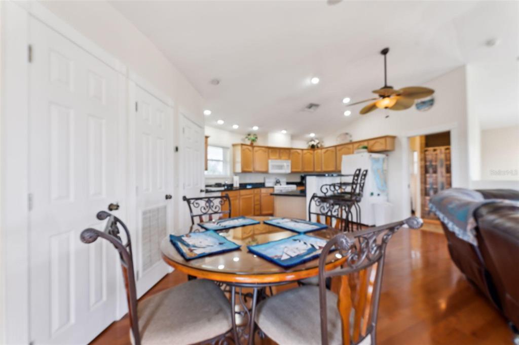 16361 Stringfellow Road Bokeelia, FL 33922 - Photo 12 of 26 a living room with furniture kitchen view and a chandelier