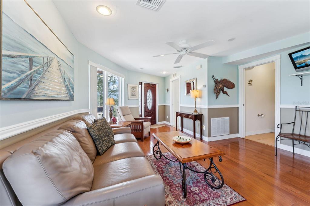 16361 Stringfellow Road Bokeelia, FL 33922 - Photo 19 of 26 a living room with furniture kitchen view and a large window