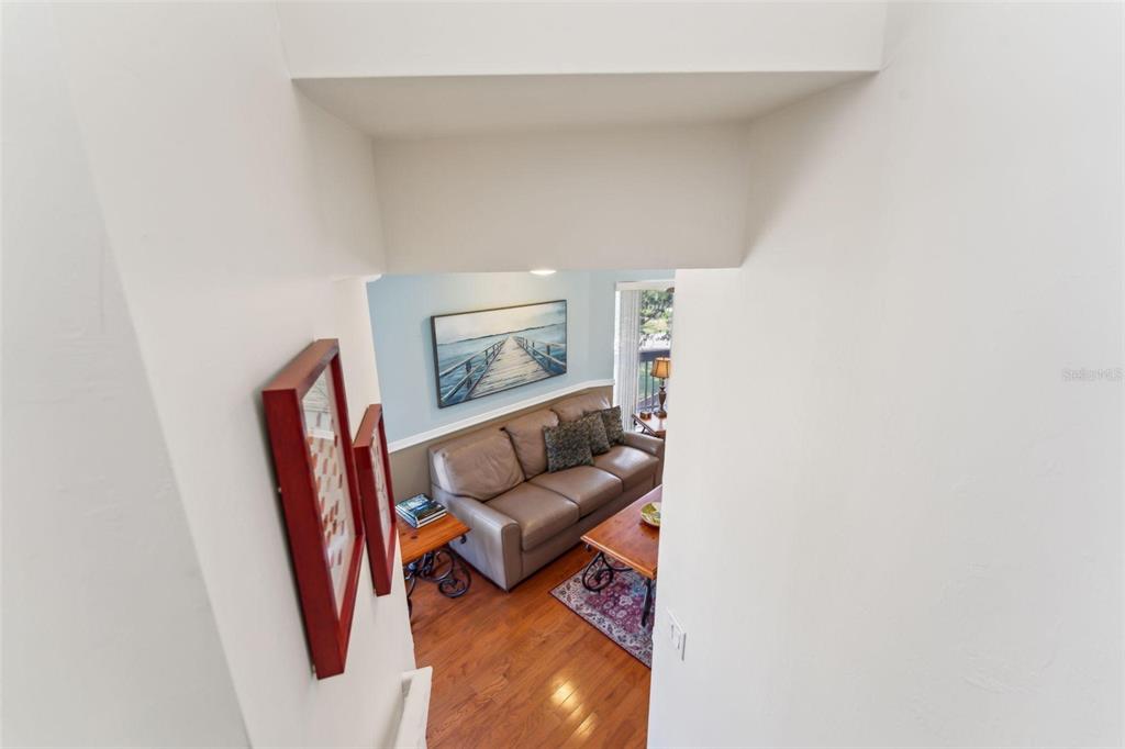 16361 Stringfellow Road Bokeelia, FL 33922 - Photo 21 of 26 a living room with furniture and a wooden floor