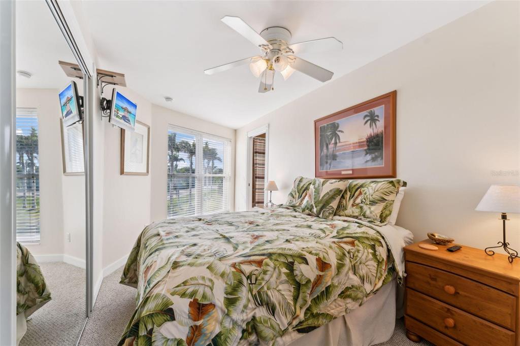 16361 Stringfellow Road Bokeelia, FL 33922 - Photo 22 of 26 a bed sitting in a bedroom next to a window