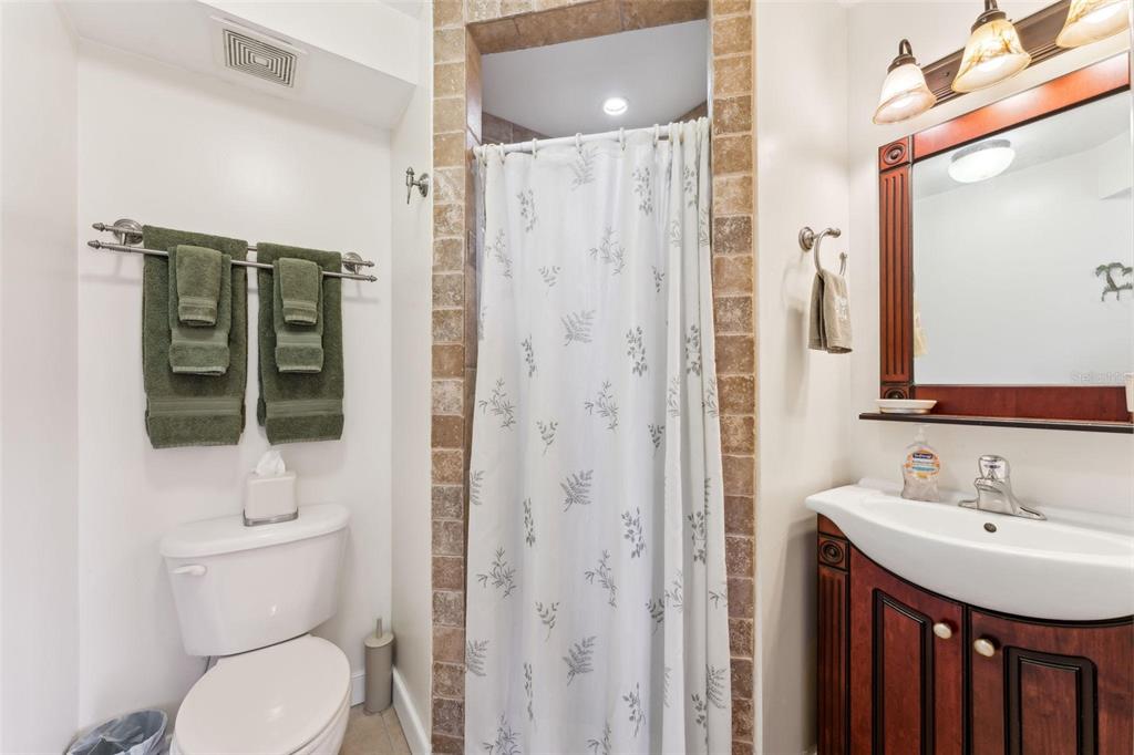 16361 Stringfellow Road Bokeelia, FL 33922 - Photo 25 of 26 a bathroom with a toilet a sink and shower