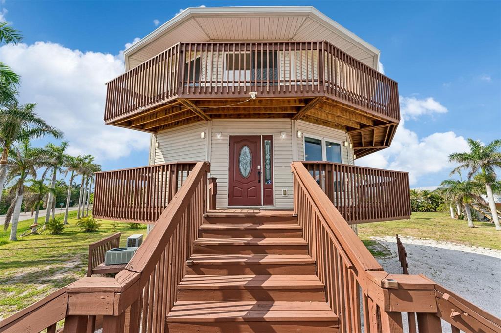 16361 Stringfellow Road Bokeelia, FL 33922 - Photo 5 of 26 a view of a house with a deck