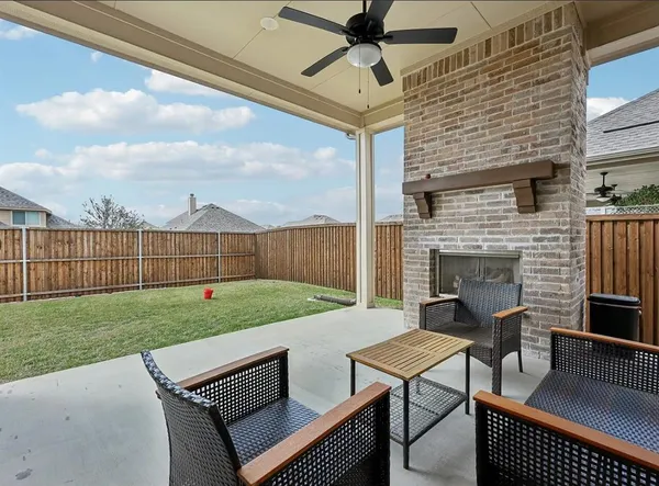 a view of backyard with seating area and stove