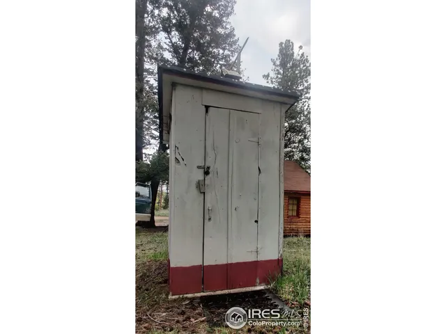 a view of a bathroom with a shower and a sink