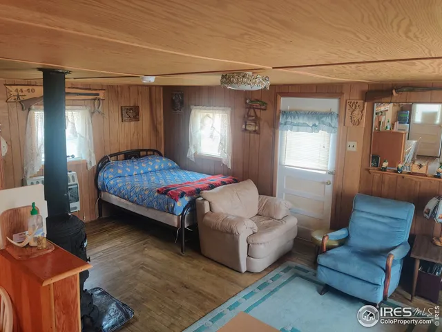 a bedroom with furniture and a window