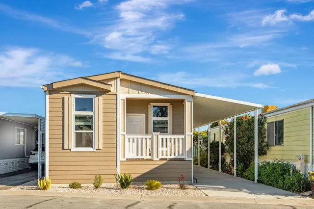 a view of a brick house with a large windows