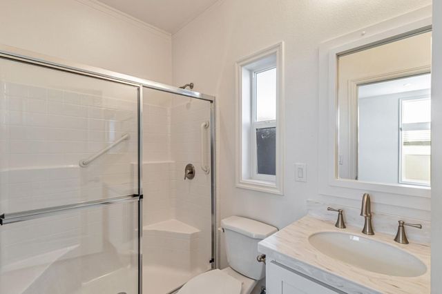 a bathroom with a shower and a toilet