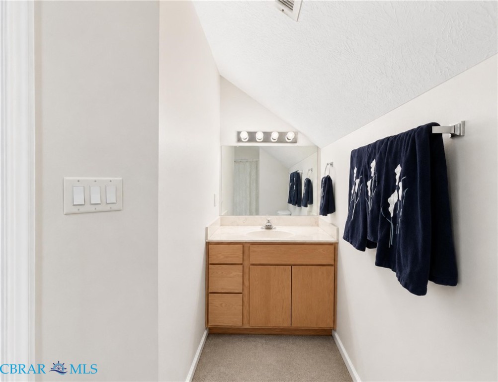 1214 Dandy Loop Road Yorktown, VA 23692 - Photo 41 of 65 a room with a sink and a mirror