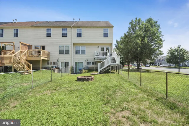 a view of a house with backyard and a slide