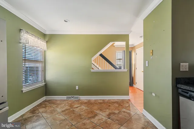 a view of a room with air conditioner and windows