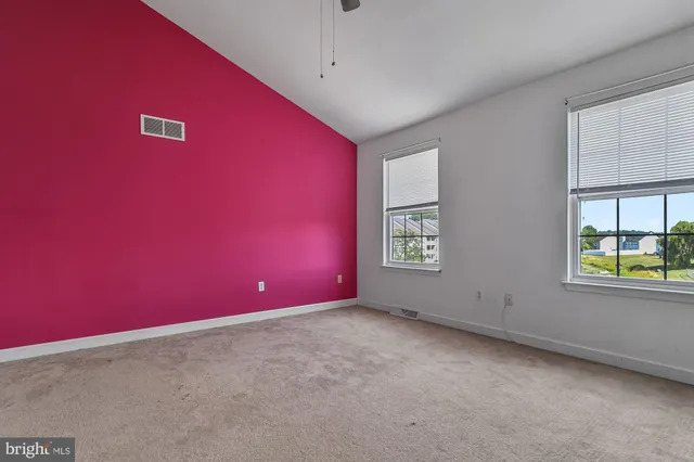 an empty room with windows