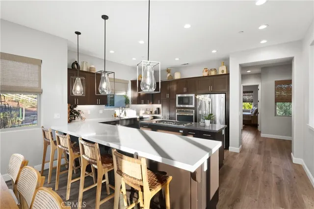 a spacious bathroom with a double vanity sink a mirror a and a window