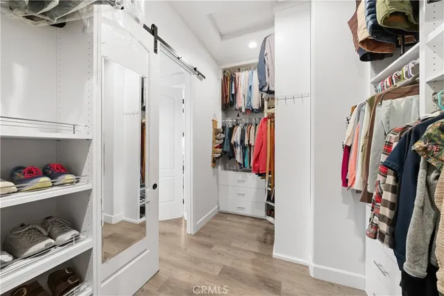 a view of a house with backyard outdoor seating area and green space