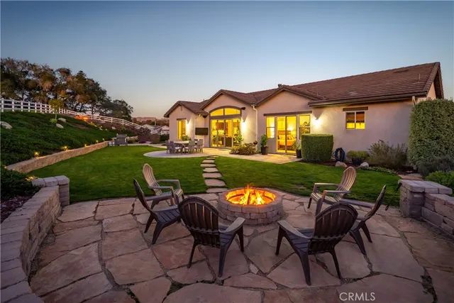 a view of a swimming pool with an outdoor seating and a garden