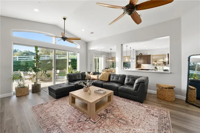 a kitchen with stainless steel appliances granite countertop a sink a refrigerator and a stove