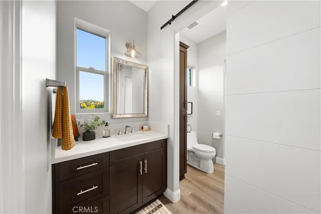 an aerial view of a house with a garden and plants